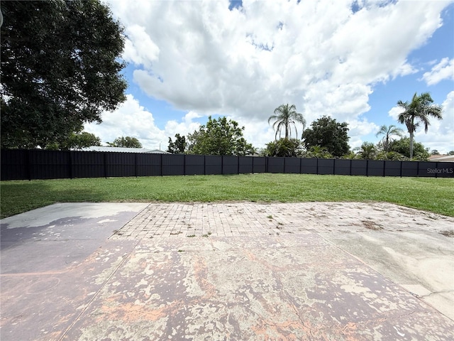 24 Charwood Cir, Lehigh Acres, FL 33936 - view of yard with a patio