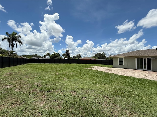 24 Charwood Cir, Lehigh Acres, FL 33936 - fenced backyard with a patio area