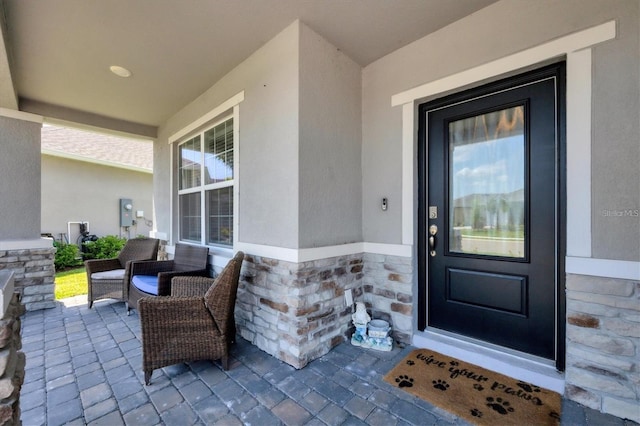16833 Terrapin Key Dr, Port Charlotte, FL 33953 - doorway to property featuring stucco siding and stone siding