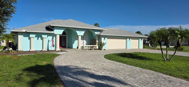 39 Norman St, Port Charlotte, FL 33954 - ranch-style home with curved driveway, a front lawn, a garage, stucco siding, and a porch