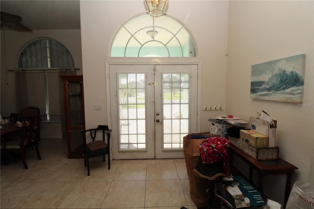 39 Norman St, Port Charlotte, FL 33954 - foyer with french doors, light tile patterned floors, and a high ceiling
