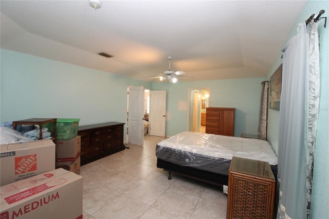 39 Norman St, Port Charlotte, FL 33954 - bedroom featuring light tile patterned flooring, ceiling fan, and a raised ceiling