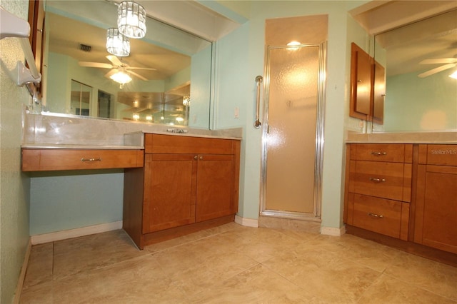 39 Norman St, Port Charlotte, FL 33954 - bathroom with ceiling fan, vanity, a shower stall, and tile patterned floors
