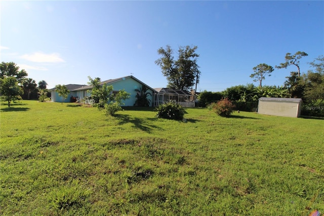 39 Norman St, Port Charlotte, FL 33954 - view of grassy yard with a storage shed