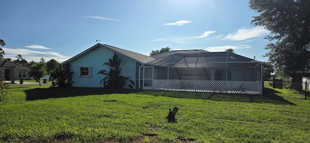 39 Norman St, Port Charlotte, FL 33954 - rear view of house with glass enclosure and stucco siding