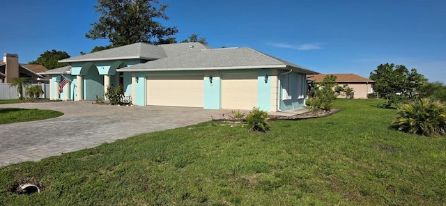 39 Norman St, Port Charlotte, FL 33954 - single story home with a garage, a front yard, decorative driveway, and stucco siding