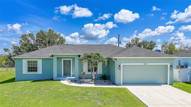 12112 Helios Ave, Port Charlotte, FL 33981 - ranch-style home featuring stucco siding, an attached garage, driveway, and roof with shingles