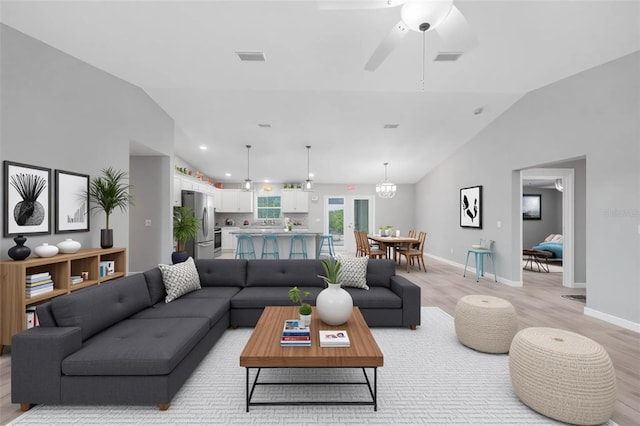 12112 Helios Ave, Port Charlotte, FL 33981 - living area featuring lofted ceiling, light wood finished floors, and ceiling fan