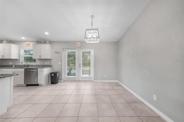 12112 Helios Ave, Port Charlotte, FL 33981 - kitchen featuring dishwasher, white cabinetry, french doors, light tile patterned flooring, and recessed lighting
