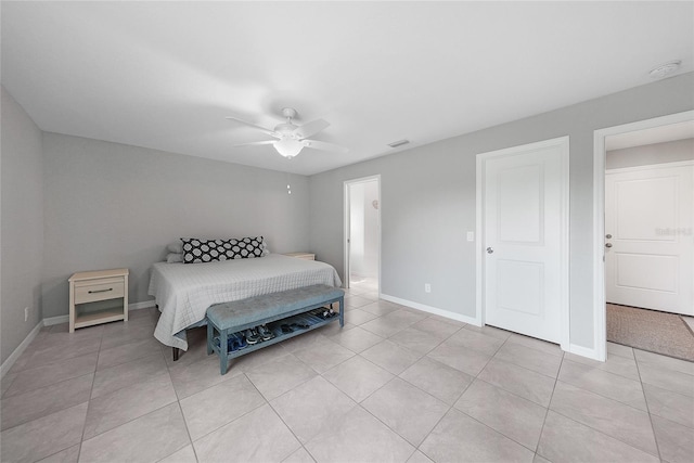12112 Helios Ave, Port Charlotte, FL 33981 - bedroom featuring light tile patterned flooring and a ceiling fan