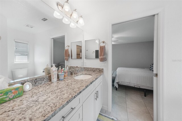 12112 Helios Ave, Port Charlotte, FL 33981 - ensuite bathroom with vanity and tile patterned flooring