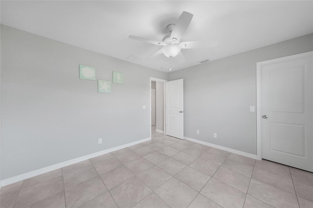 12112 Helios Ave, Port Charlotte, FL 33981 - unfurnished bedroom featuring light tile patterned flooring and a ceiling fan