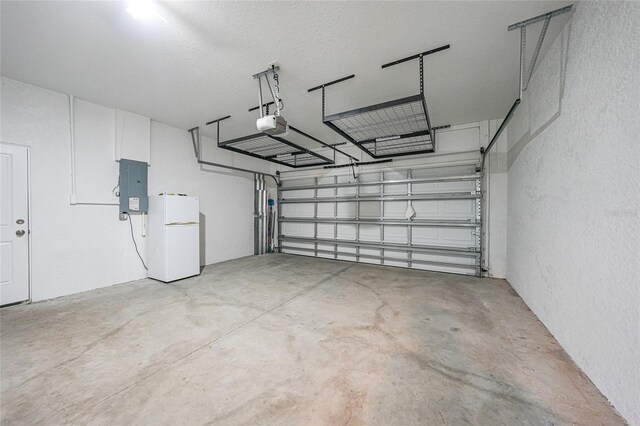 12112 Helios Ave, Port Charlotte, FL 33981 - garage with freestanding refrigerator, electric panel, a garage door opener, and a textured wall