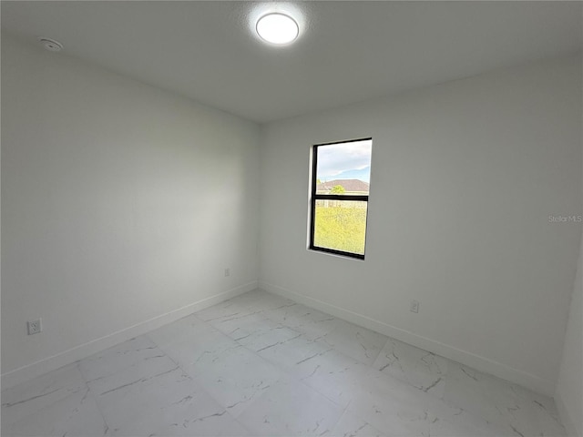 3113 58th, Lehigh Acres, FL 33971 - unfurnished room with light marble finish floors and a smoke detector