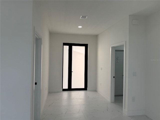 3113 58th, Lehigh Acres, FL 33971 - corridor with light marble finish flooring and recessed lighting