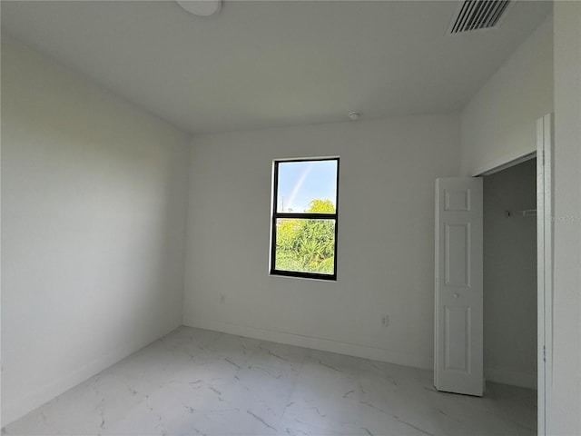 3113 58th, Lehigh Acres, FL 33971 - unfurnished bedroom featuring marble finish floors and baseboards