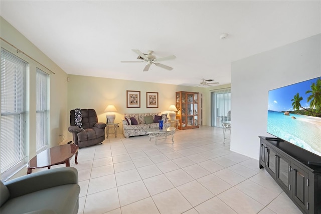 475 Whippoorwill Dr, Venice, FL 34293 - living area with light tile patterned flooring, ceiling fan, and plenty of natural light