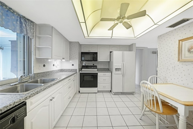 475 Whippoorwill Dr, Venice, FL 34293 - kitchen with white appliances, wallpapered walls, ceiling fan, open shelves, and light countertops