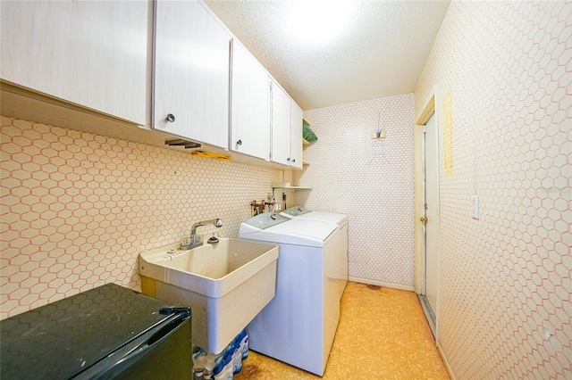 475 Whippoorwill Dr, Venice, FL 34293 - laundry room featuring cabinet space, independent washer and dryer, and wallpapered walls