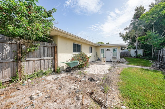 475 Whippoorwill Dr, Venice, FL 34293 - back of house featuring stucco siding