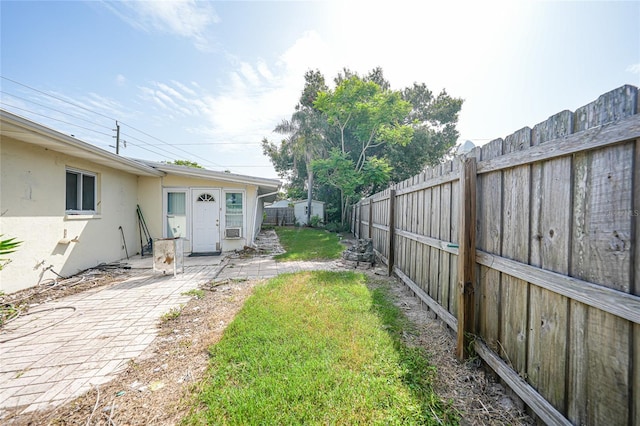 475 Whippoorwill Dr, Venice, FL 34293 - fenced backyard with a patio area