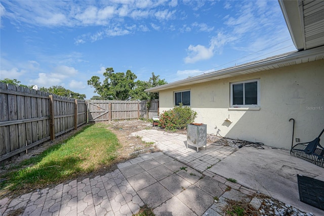 475 Whippoorwill Dr, Venice, FL 34293 - fenced backyard with a patio and a gate