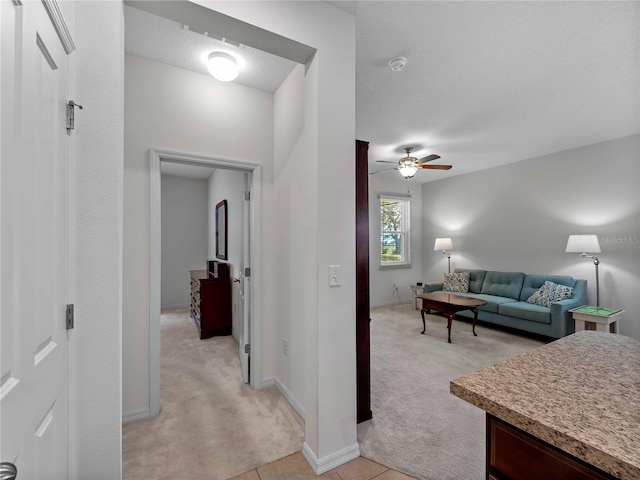 8814 Tuscany Isles Dr, Punta Gorda, FL 33950 - living area with light colored carpet and a ceiling fan