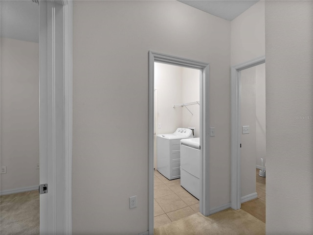 8814 Tuscany Isles Dr, Punta Gorda, FL 33950 - laundry room featuring washer and clothes dryer, light tile patterned floors, and light colored carpet