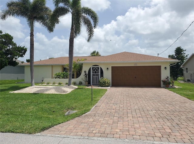 2220 Broad Ranch Dr, Port Charlotte, FL 33948 - ranch-style home with decorative driveway, a front yard, a garage, and stucco siding