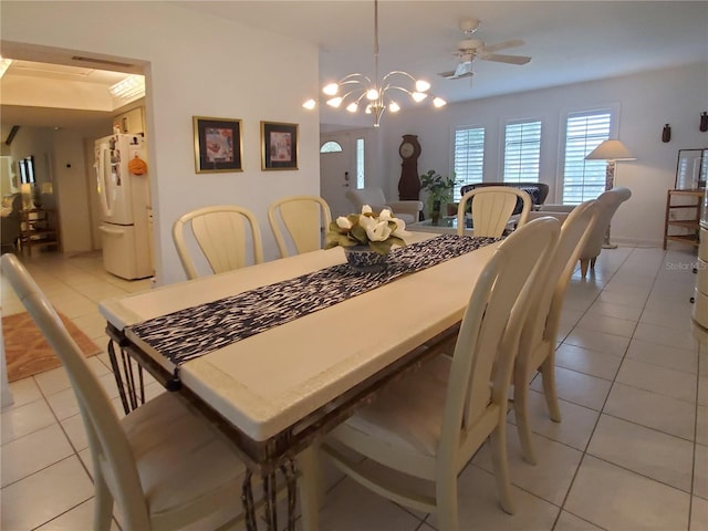 2220 Broad Ranch Dr, Port Charlotte, FL 33948 - dining area featuring light tile patterned floors, ceiling fan, and a chandelier