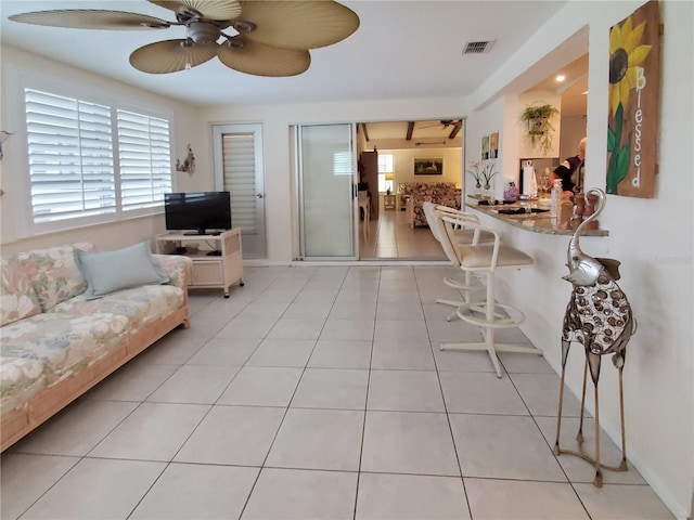 2220 Broad Ranch Dr, Port Charlotte, FL 33948 - living room with ceiling fan and light tile patterned floors
