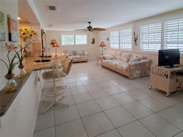 2220 Broad Ranch Dr, Port Charlotte, FL 33948 - living area with a ceiling fan and light tile patterned flooring