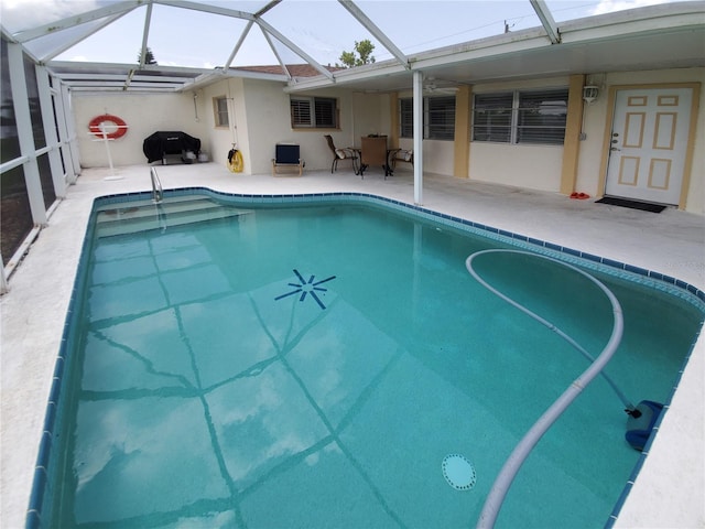 2220 Broad Ranch Dr, Port Charlotte, FL 33948 - outdoor pool featuring a patio area and glass enclosure