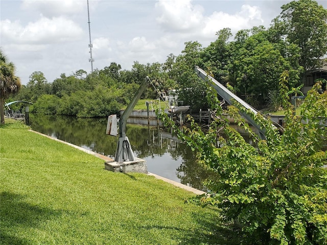 2220 Broad Ranch Dr, Port Charlotte, FL 33948 - dock featuring a lawn and a water view