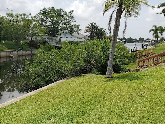 2220 Broad Ranch Dr, Port Charlotte, FL 33948 - view of green lawn with a water view