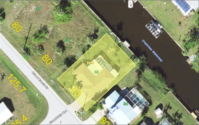 2220 Broad Ranch Dr, Port Charlotte, FL 33948 - aerial map of property and surrounding area featuring property boundaries highlighted