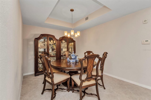 900 E Marion Ave Unit 1403, Punta Gorda, FL 33950 - dining space with a chandelier, a raised ceiling, and light tile patterned floors