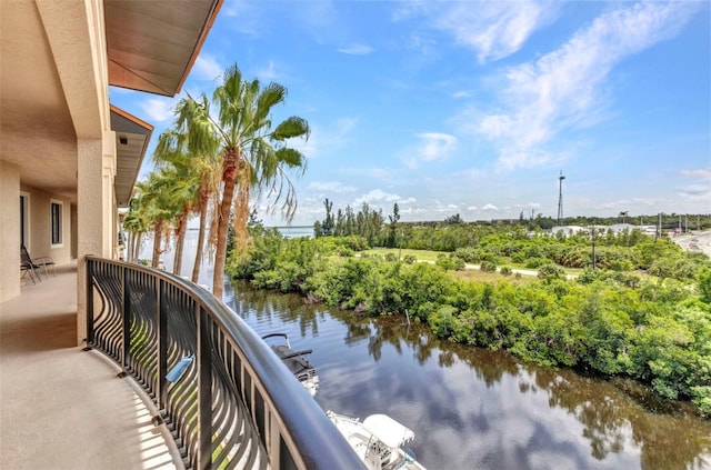 900 E Marion Ave Unit 1403, Punta Gorda, FL 33950 - balcony featuring a water view and view of wooded area