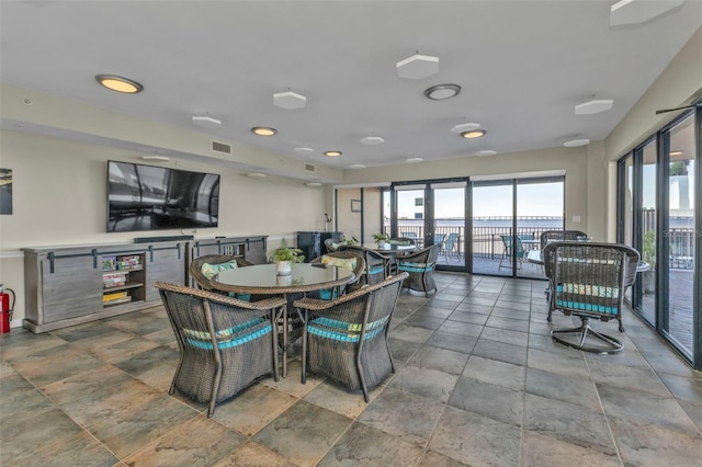 900 E Marion Ave Unit 1403, Punta Gorda, FL 33950 - dining room with healthy amount of natural light, stone finish floors, and recessed lighting