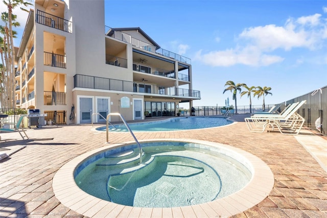 900 E Marion Ave Unit 1403, Punta Gorda, FL 33950 - community pool with a hot tub, grilling area, and a patio area