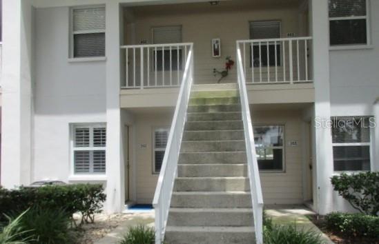 429 Cerromar Ln Unit 353, Venice, FL 34293 - entrance to property with a balcony and stucco siding