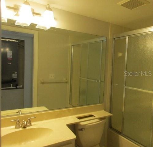 429 Cerromar Ln Unit 353, Venice, FL 34293 - bathroom featuring vanity and shower / bath combination with glass door