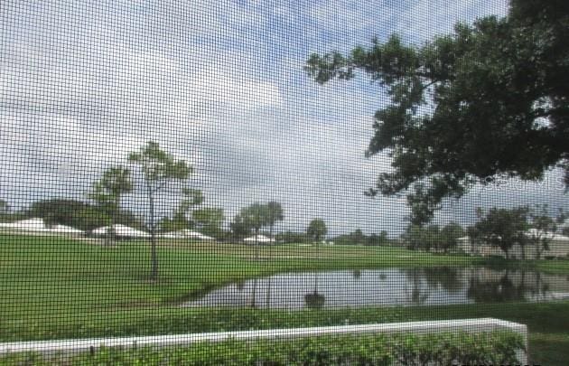 429 Cerromar Ln Unit 353, Venice, FL 34293 - view of community with a yard and a water view