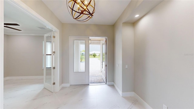 2073 Treasure Ln, Punta Gorda, FL 33982 - entrance foyer featuring a chandelier and ceiling fan