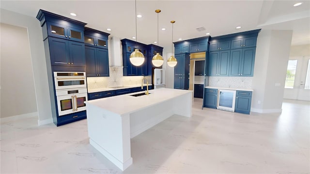 2073 Treasure Ln, Punta Gorda, FL 33982 - kitchen featuring wine cooler, blue cabinetry, white double oven, backsplash, and recessed lighting
