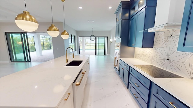 2073 Treasure Ln, Punta Gorda, FL 33982 - kitchen featuring black electric cooktop, dishwashing machine, blue cabinetry, a spacious island, and recessed lighting