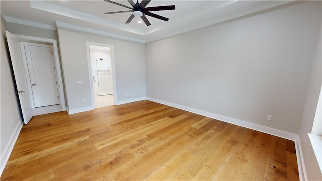 2073 Treasure Ln, Punta Gorda, FL 33982 - spare room featuring ceiling fan, a tray ceiling, ornamental molding, light wood finished floors, and recessed lighting