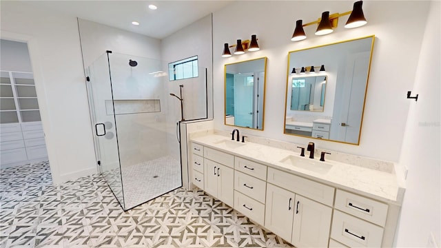 2073 Treasure Ln, Punta Gorda, FL 33982 - bathroom with a stall shower, double vanity, and recessed lighting