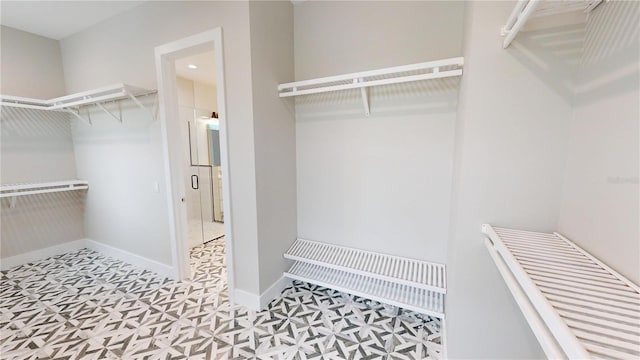 2073 Treasure Ln, Punta Gorda, FL 33982 - walk in closet with tile patterned floors