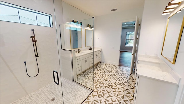 2073 Treasure Ln, Punta Gorda, FL 33982 - bathroom with double vanity and a stall shower